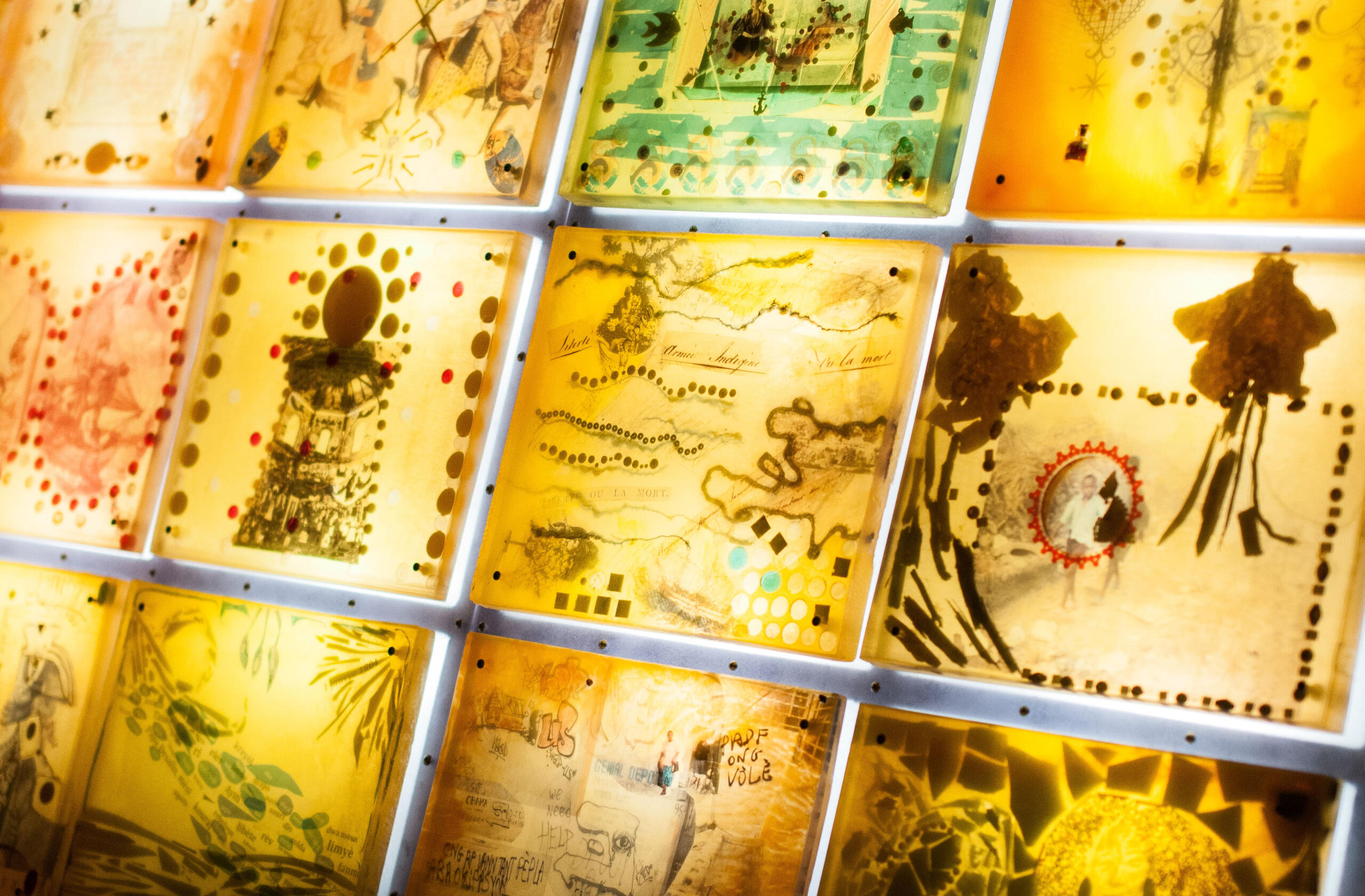 Haiti mural made of amber with lights behind it